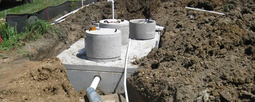Septic system repair and installation site with tank access ports in Kansas City, KS